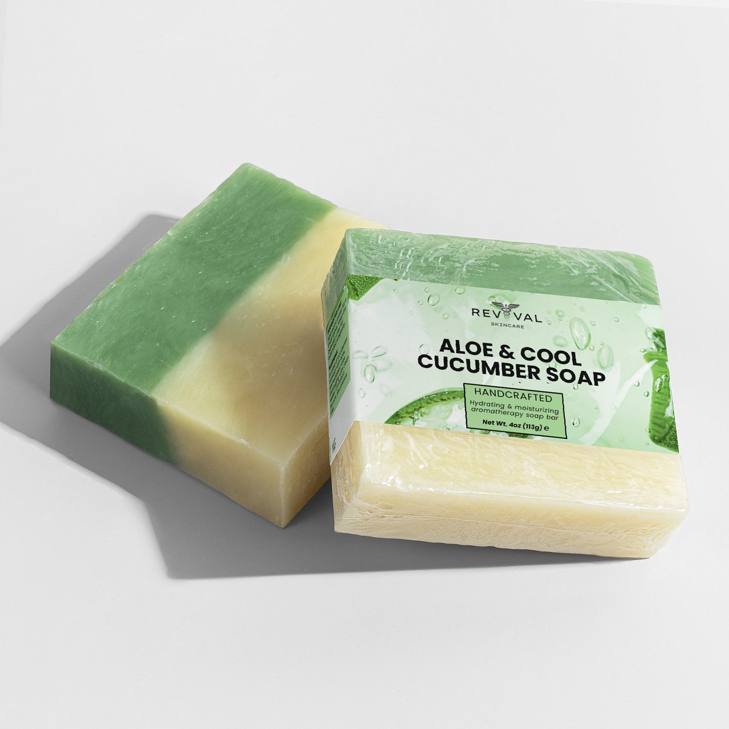Green and beige soap bar with packaging labeled 'Aloe & Cool Cucumber Soap' on a light gray background.