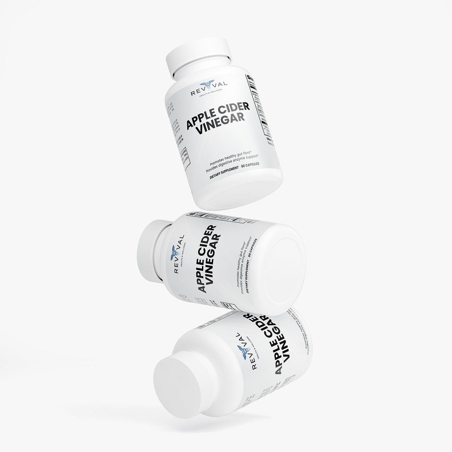 Three bottles of Reval Apple Cider Vinegar on a white background