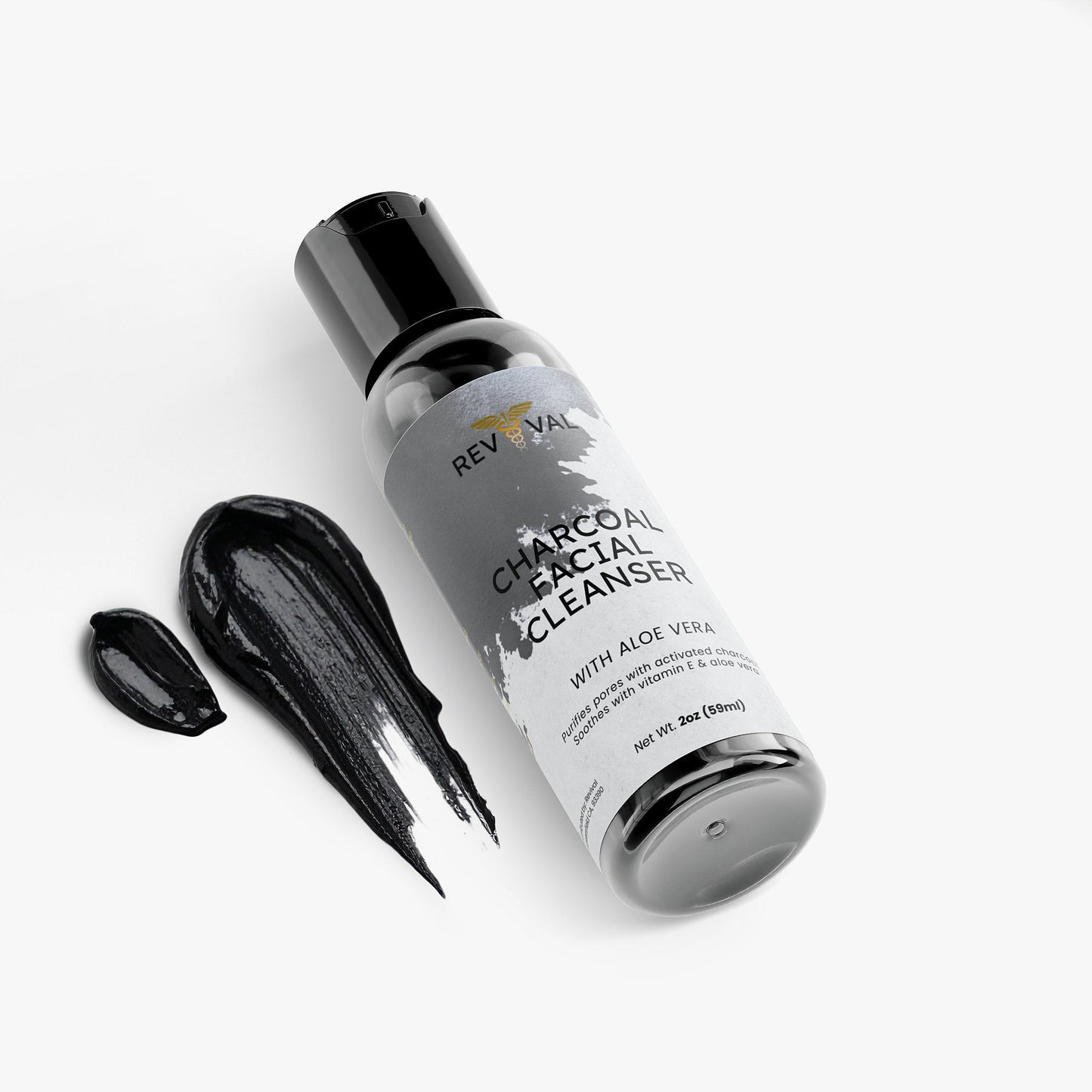 Revival Charcoal Facial Cleanser bottle with black liquid on a white background