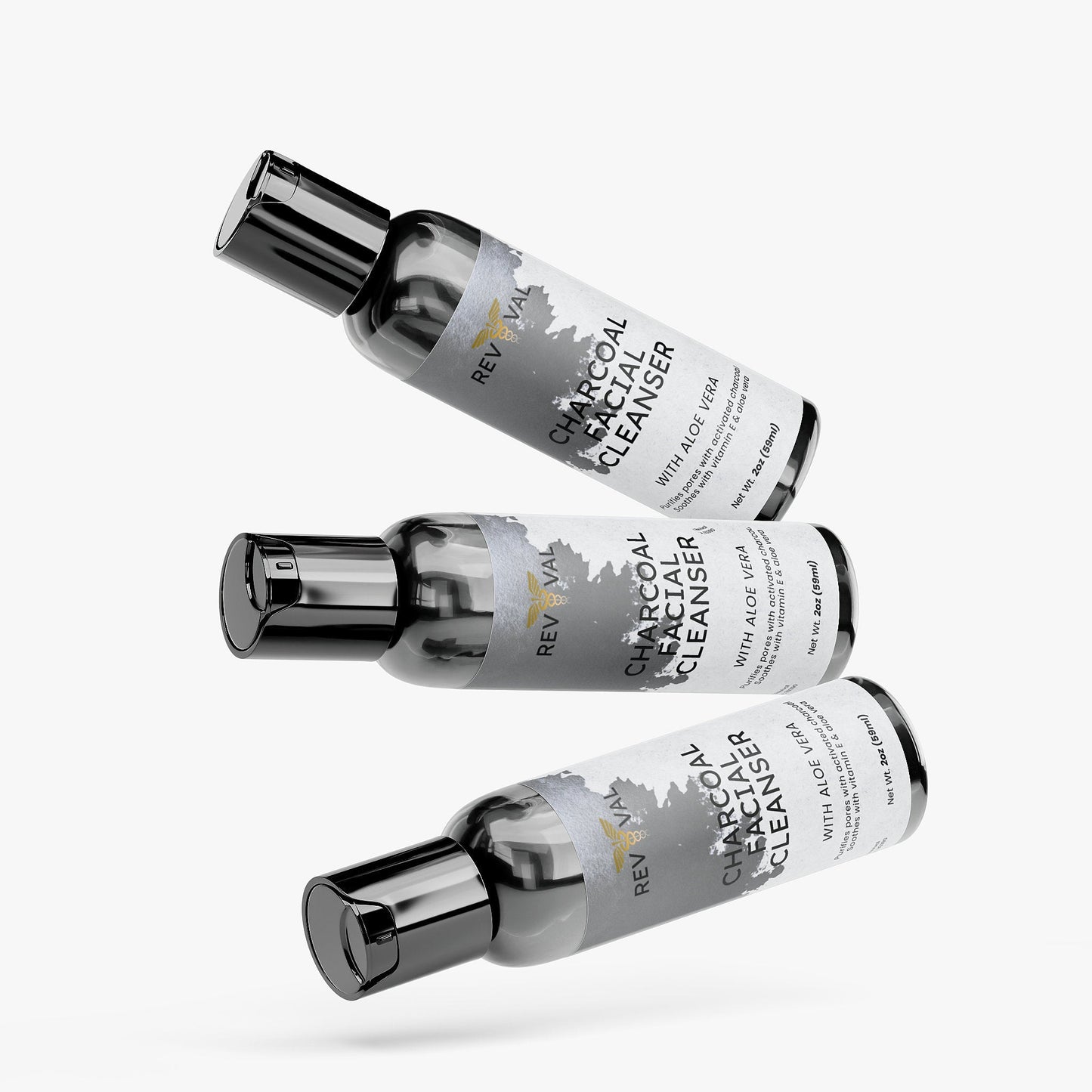 Three bottles of Reviva Charcoal Facial Cleanser with Aloe Vera on a white background