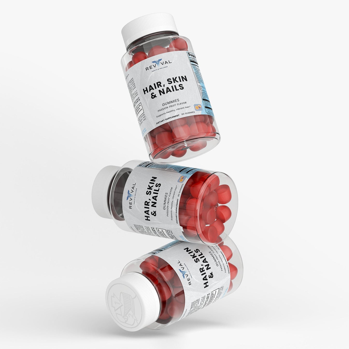 Three bottles of Revival Hair, Skin & Nails supplements on a white background