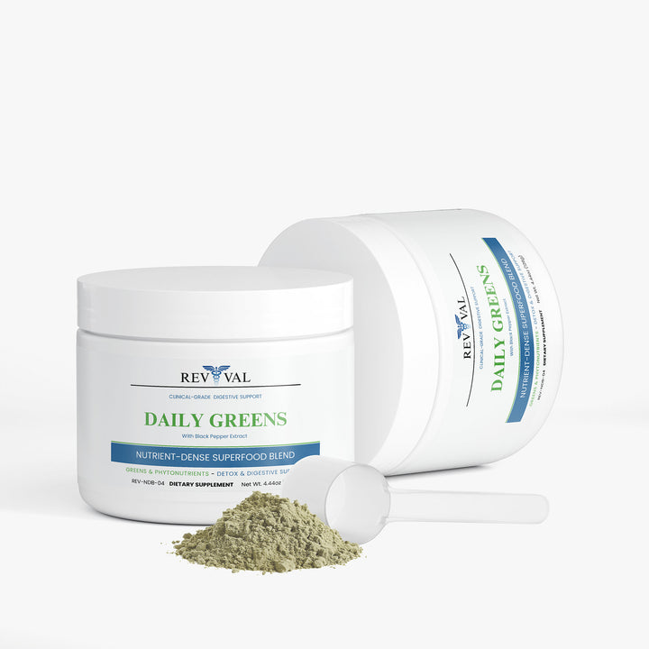 Revival Daily Greens supplement jar with scoop and powder on a white background