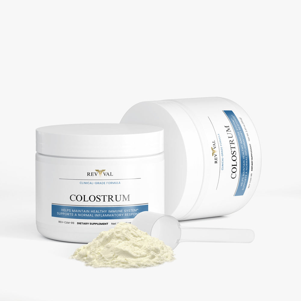 Revival Colostrum supplement with a scoop of powder on a white background