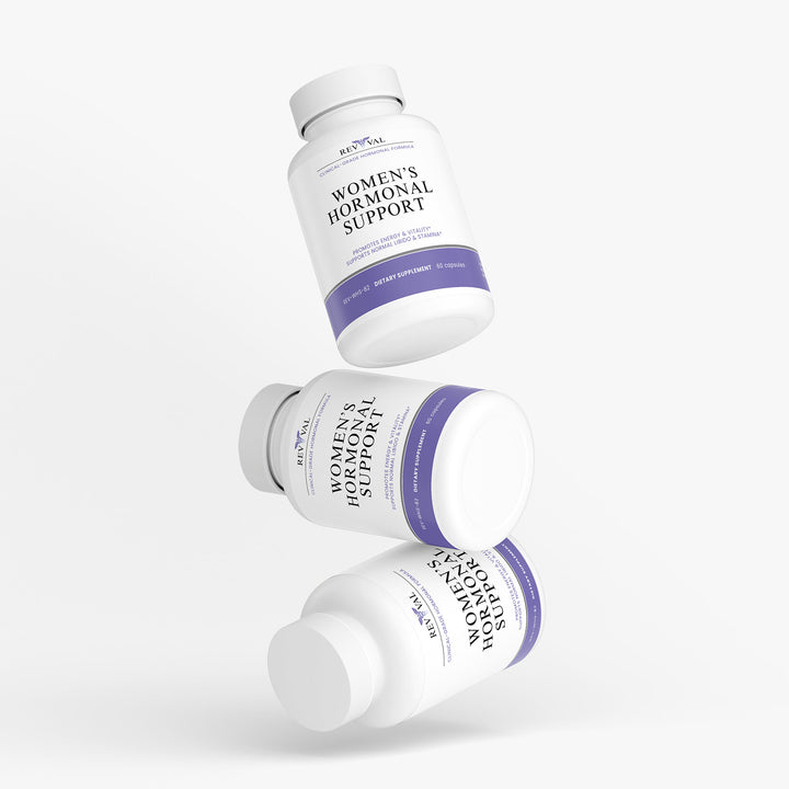 Three bottles of Women's Hormonal Support supplement on a white background