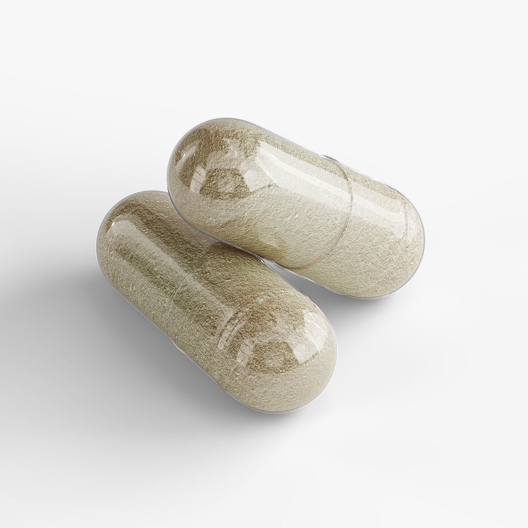 Two beige capsules on a white background