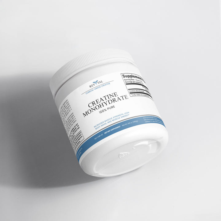 Container of creatine monohydrate supplement on a light gray background
