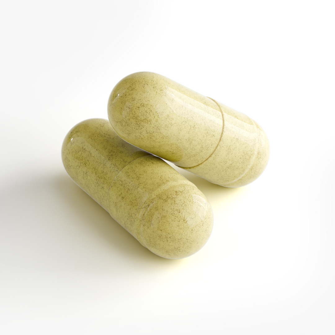 Two pale yellow-green herbal supplement capsules with a speckled texture, resting on a clean white background.