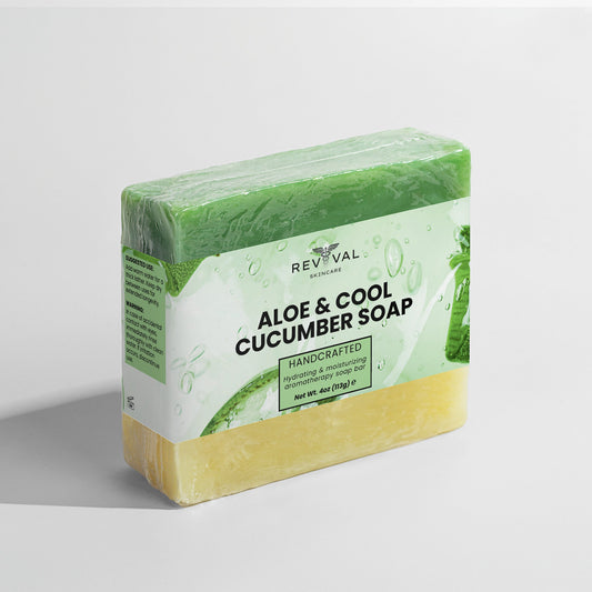 Block of aloe and cucumber soap with green packaging on a light gray background