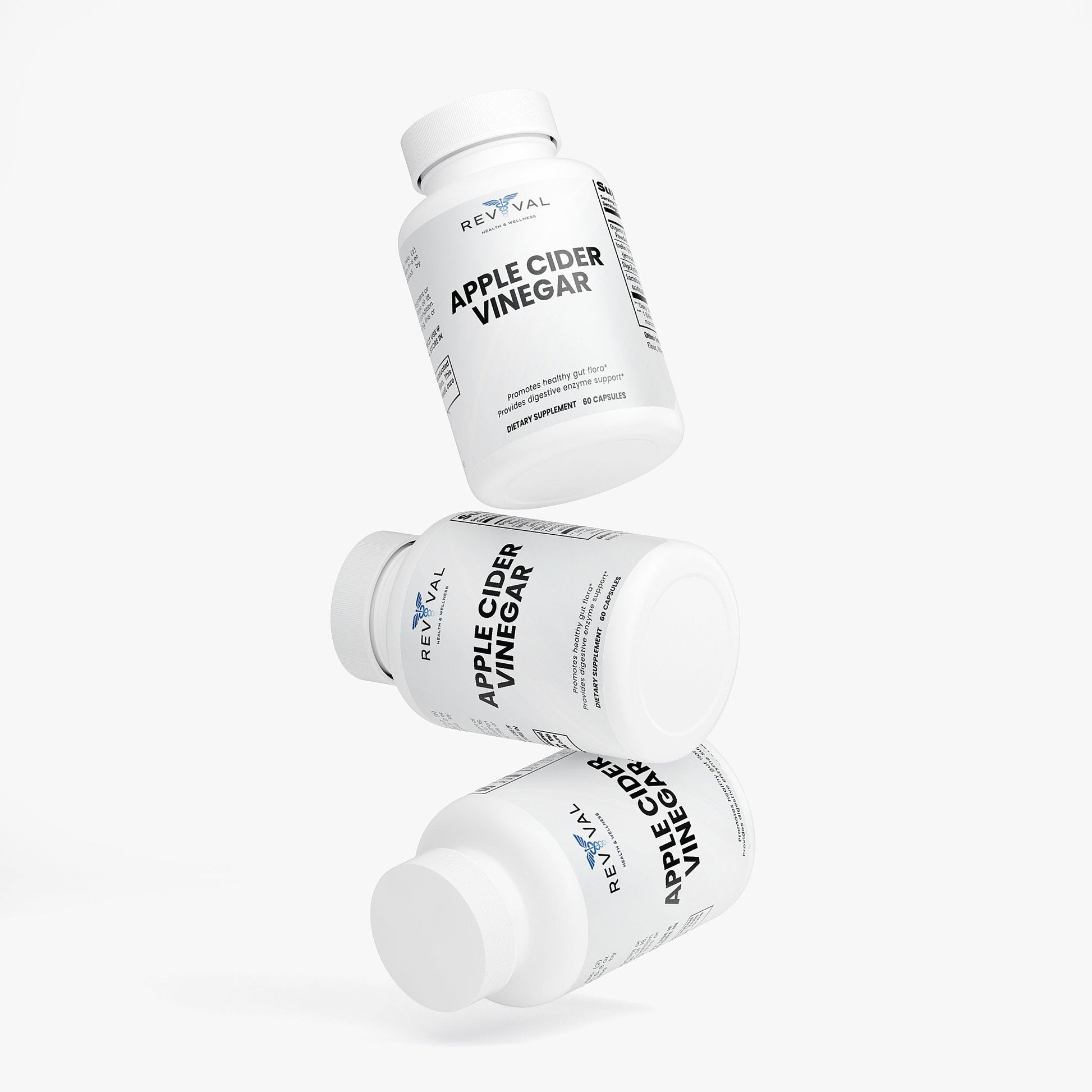 Three bottles of Reval Apple Cider Vinegar on a white background