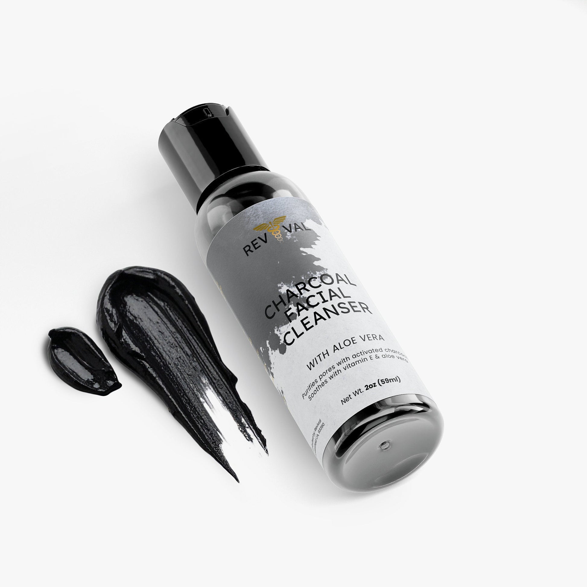 Revival Charcoal Facial Cleanser bottle with black liquid on a white background
