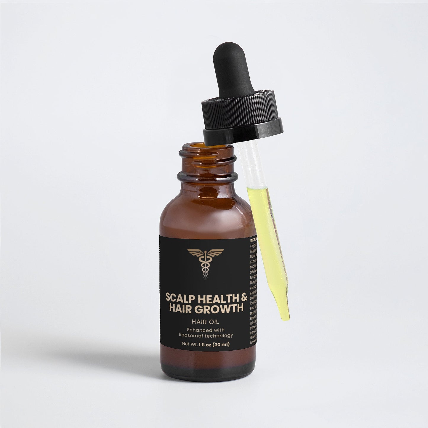 Bottle of scalp health and hair growth hair oil with a dropper on a light gray background
