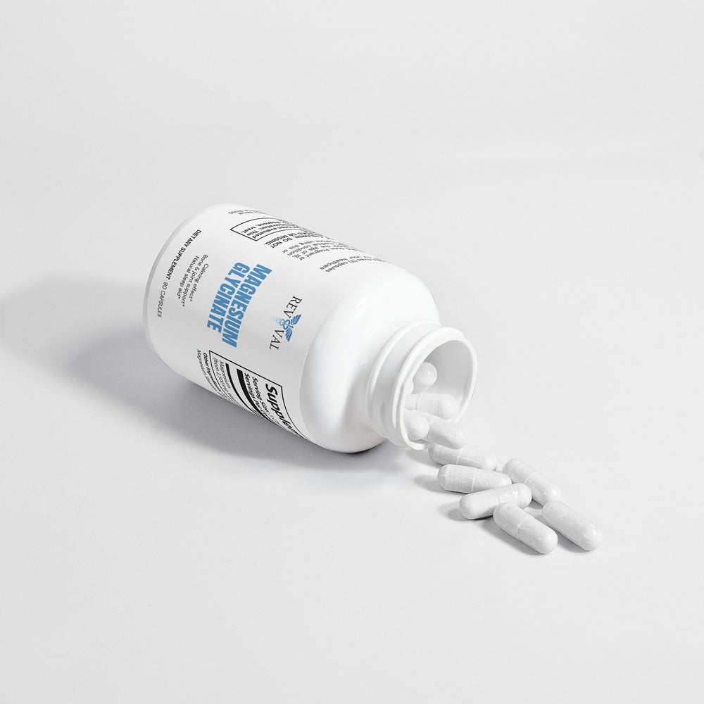 White supplement bottle with pills spilling out on a light gray background