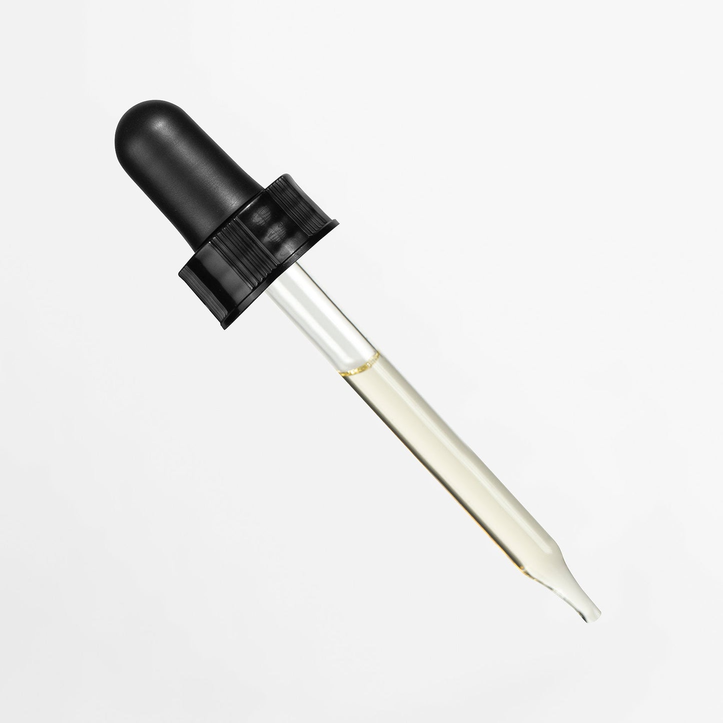 Black dropper bottle with clear liquid on a white background