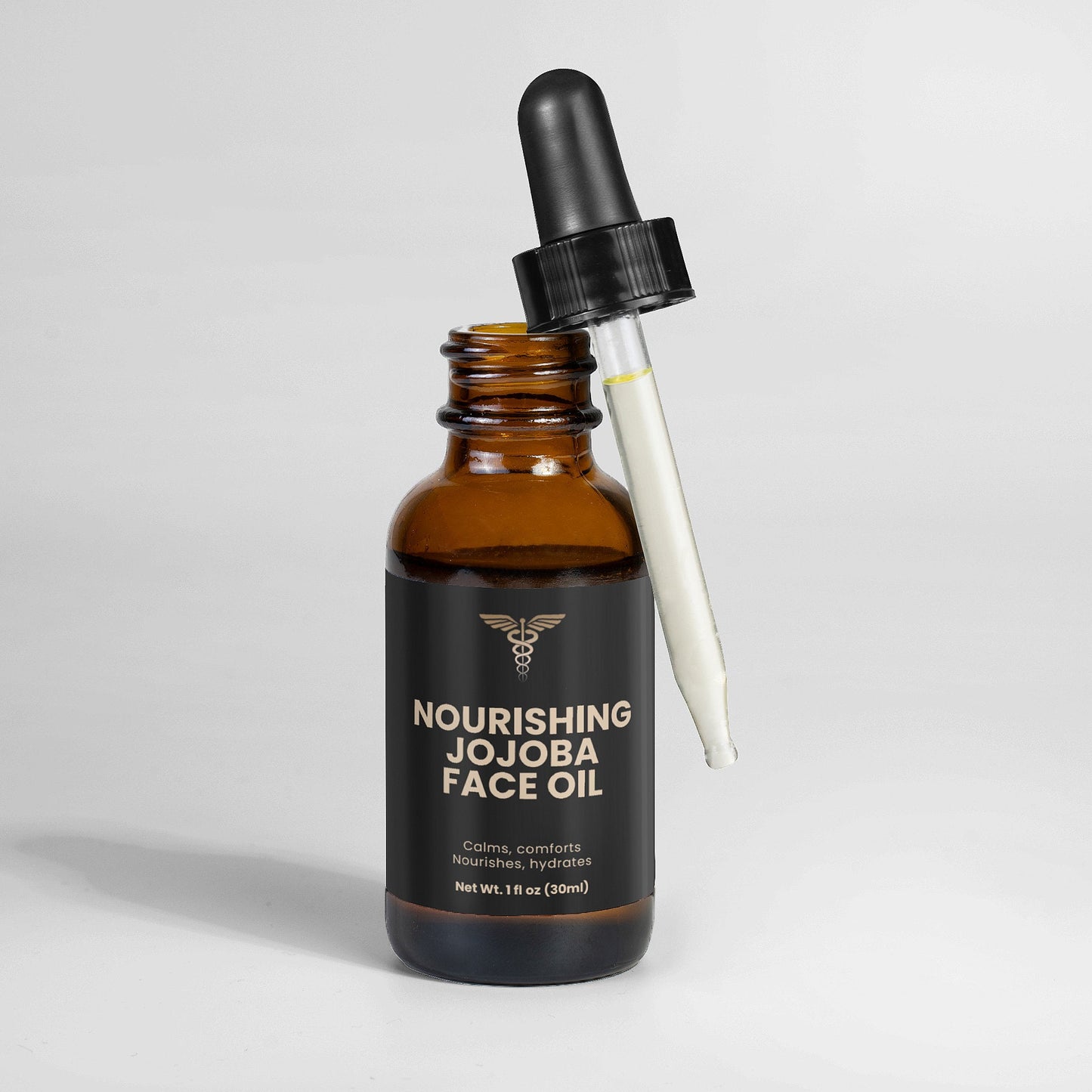 Brown glass bottle of Nourishing Jojoba Face Oil with dropper on a light gray background