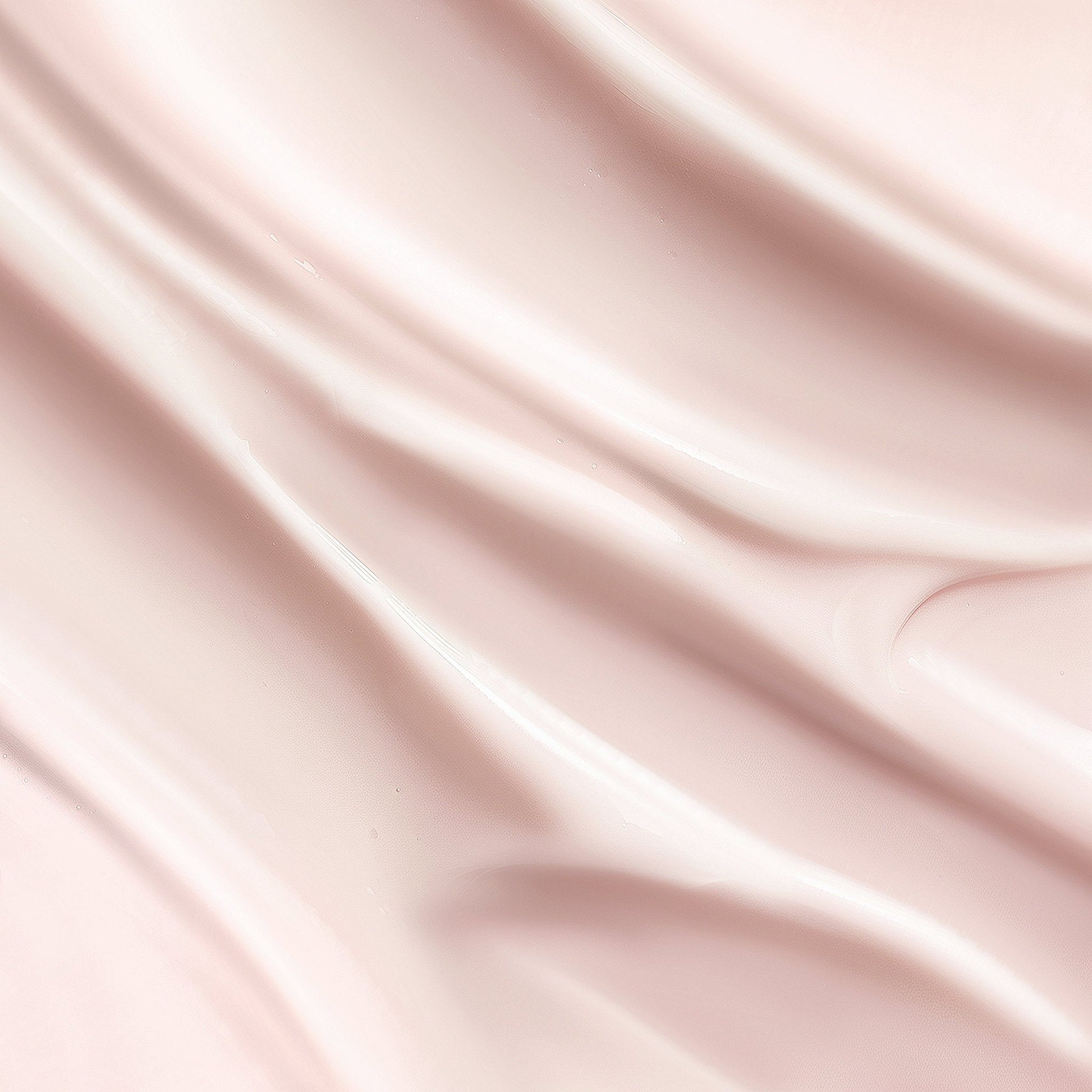 Silky pink fabric with soft folds and creases