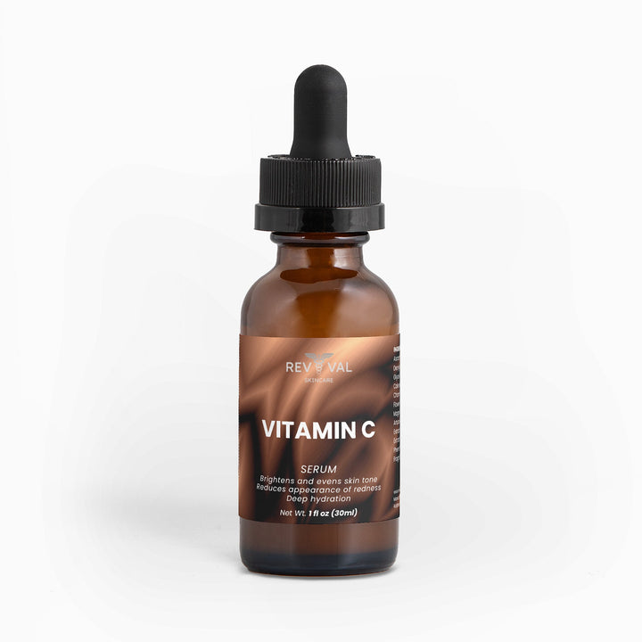 Brown bottle of Vitamin C serum with a dropper on a white background